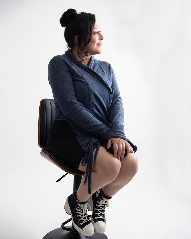 Woman Sitting on a chair in the studio